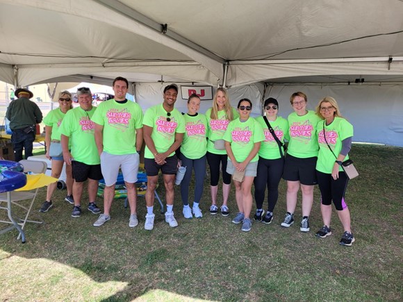 LAVIDGE IMPACT volunteers stop for a break during a service project for the Arizona Special Olympics.