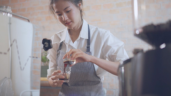 Barista pouring espresso